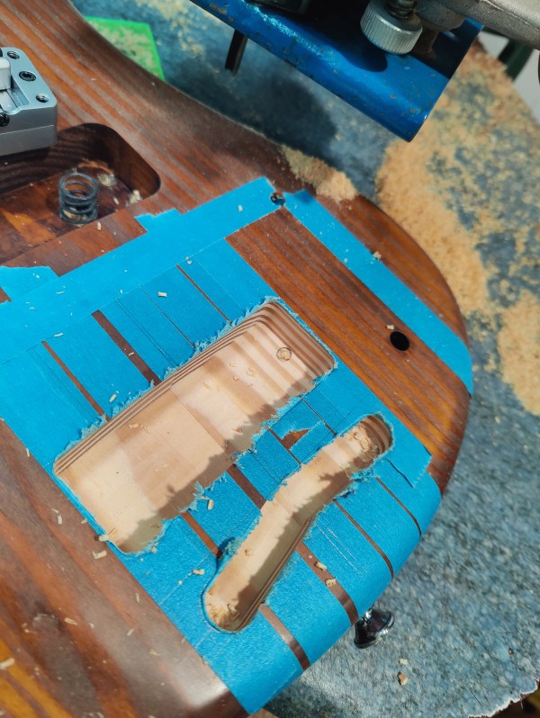 A stack of mahogany neck blanks await machining